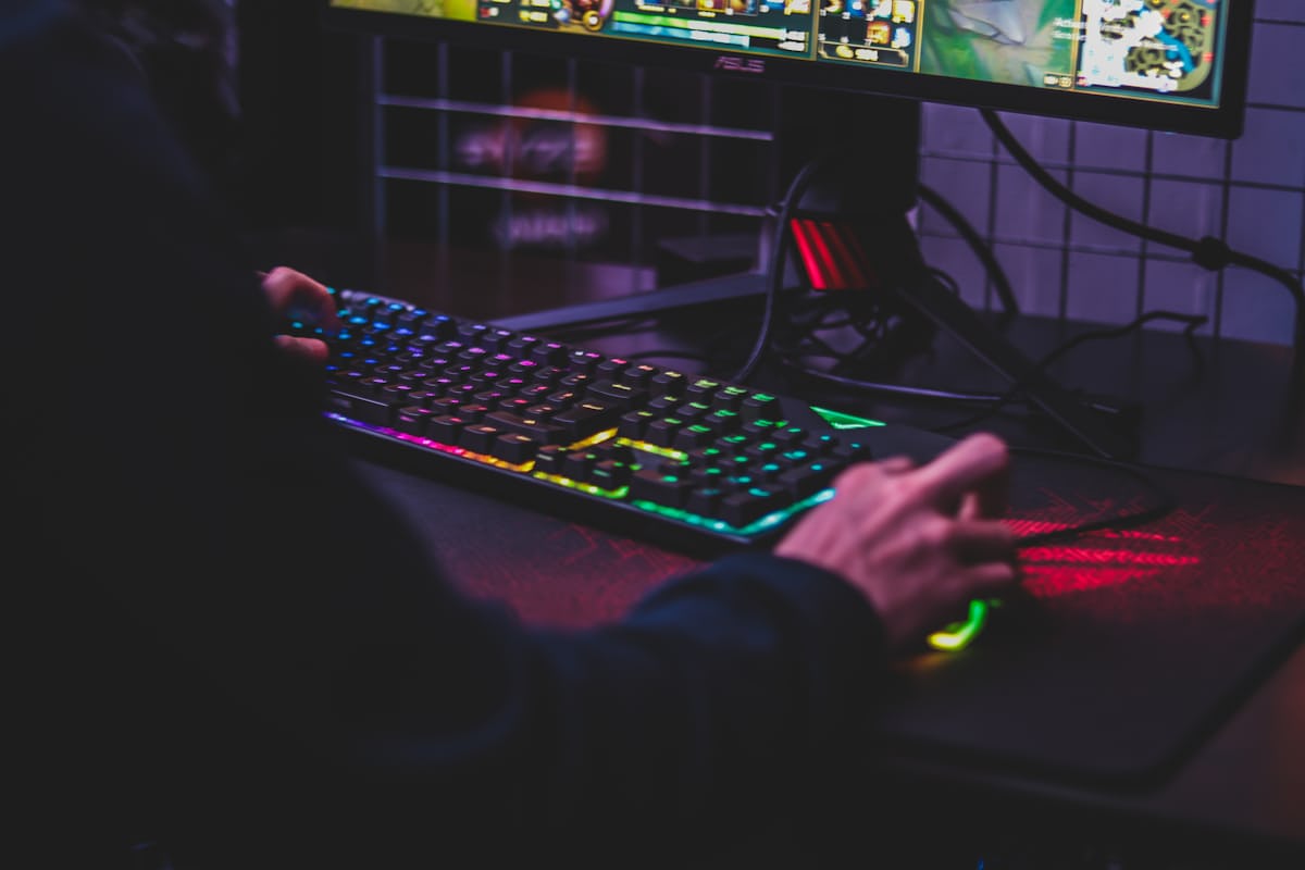 Player focused on an action game on screen