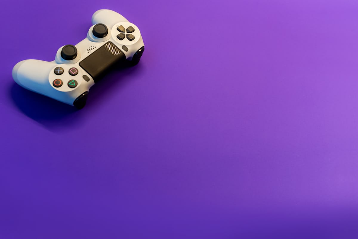 Gamer with headset enjoying a colourful game scene